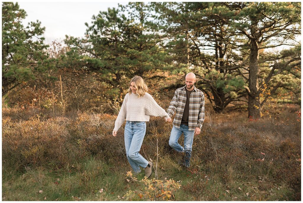couple walking through the woods