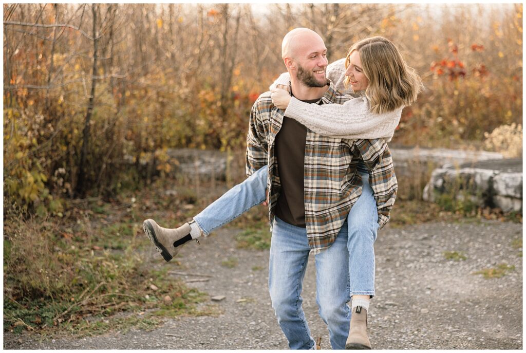 Couple doing piggyback ride laughing
