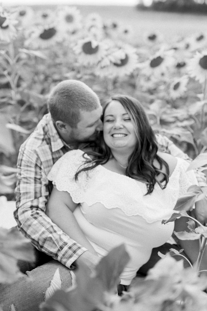 black and white couple engagement session cudding chambersburg sunflower field